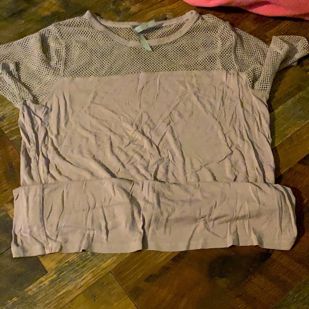 This blouse has mesh at the top it is like a dull pink